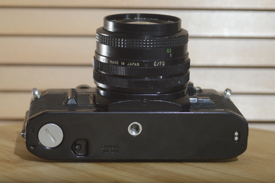 Black Canon AE1 with Vivitar 28mm f2.8 lens. Fantastic set up and beautiful condition - Rewind Cameras 
