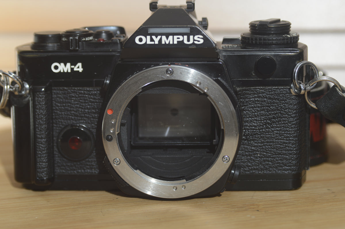 Black Olympus OM4 SLR Camera Body With Olympus Strap. In Fantastic