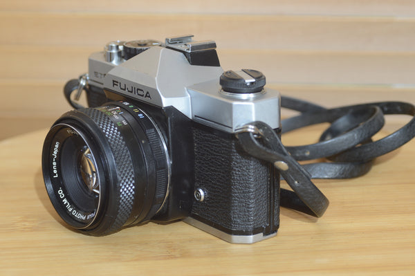 Fujica ST605 35mm SLR camera with 55mm f2.2 lens and case, vintage solid camera from Rewind Cameras.