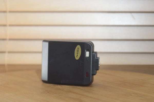 Canon Speedlite 244t flash unit with case in original box, suitable for vintage photography setups.
