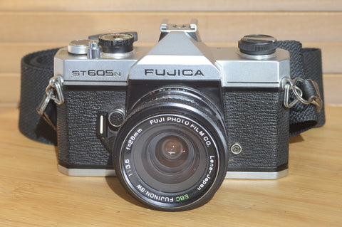 Fujica ST605n SLR with 28mm f3.5 lens and case.  A striking vintage camera.