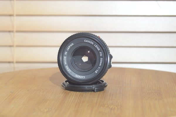 Canon FDn 50mm f1.8 prime lens in excellent condition, Olympic Games Edition, 35mm camera lens by Rewind Cameras.