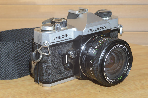 Fujica ST605n SLR with 28mm f3.5 lens and case.  A striking vintage camera.