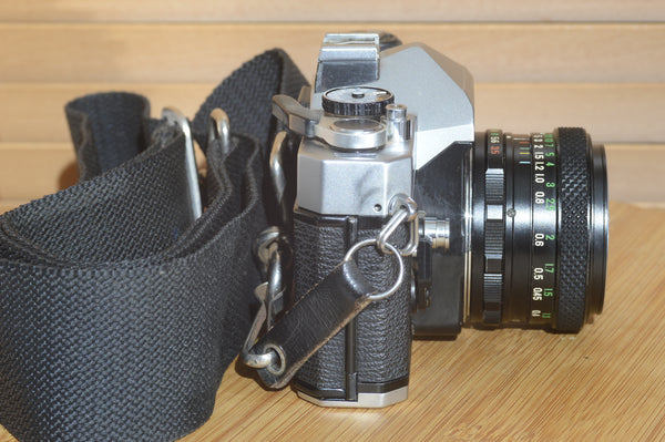 Fujica ST605n SLR with 28mm f3.5 lens and case.  A striking vintage camera.