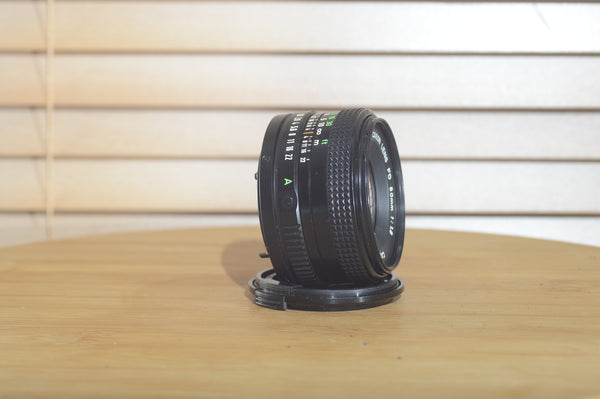Canon FDn 50mm f1.8 prime lens in excellent condition, Olympic Games Edition, 35mm film camera lens from Rewind Cameras