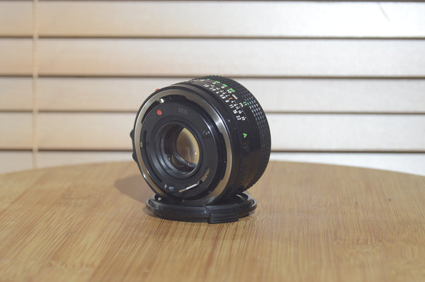 Canon FDn 50mm f1.8 prime lens in fantastic condition, Olympic Games edition, 35mm camera lens by Rewind Cameras.