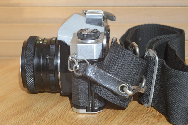 Fujica ST605n SLR with 28mm f3.5 lens and case.  A striking vintage camera.