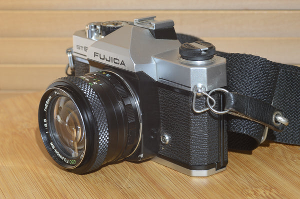 Fujica ST605n SLR with 28mm f3.5 lens and case.  A striking vintage camera.