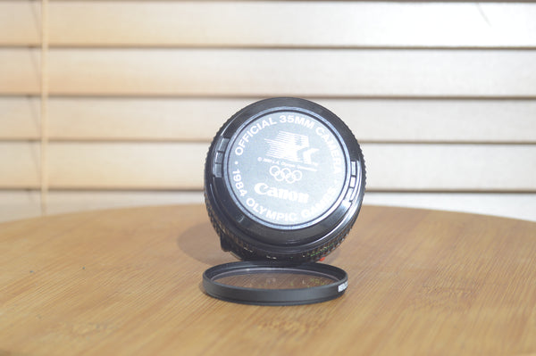 Canon FDn 50mm f1.8 prime lens in excellent condition, Olympic Games Edition, 35mm camera lens by Rewind Cameras.