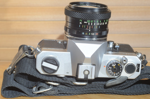 Fujica ST605n SLR with 28mm f3.5 lens and case.  A striking vintage camera.