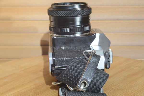 Fujica ST605n SLR with 28mm f3.5 lens and case.  A striking vintage camera.