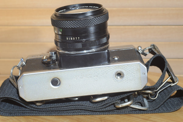 Fujica ST605n SLR with 28mm f3.5 lens and case.  A striking vintage camera.