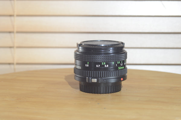 Canon FDn 50mm f1.8 prime lens in fantastic condition, Olympic Games Edition, 35mm camera lens by Rewind Cameras.