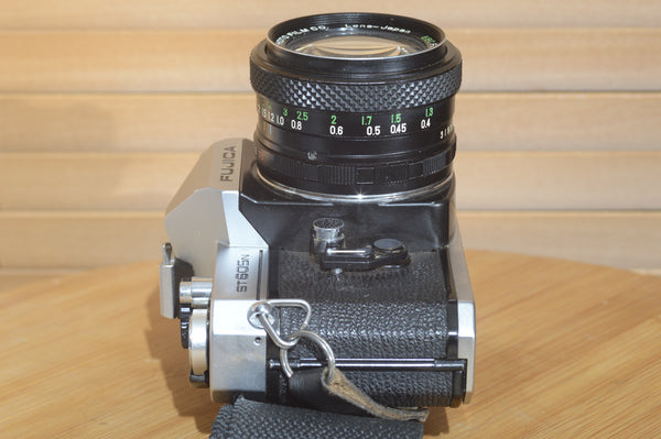 Fujica ST605n SLR with 28mm f3.5 lens and case.  A striking vintage camera.