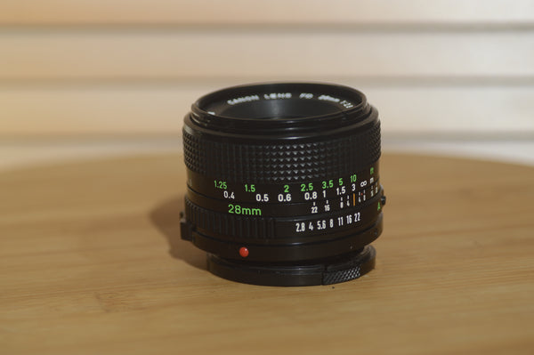 Canon FD 28mm f2.8 lens. This is a fantastic wide angle lens in superb condition. - Rewind Cameras 