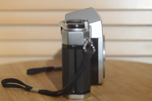 Asahi Spotmatic sp 1000 with strap. These are super collectable now, why not add one of our M42 lenses? - Rewind Cameras 
