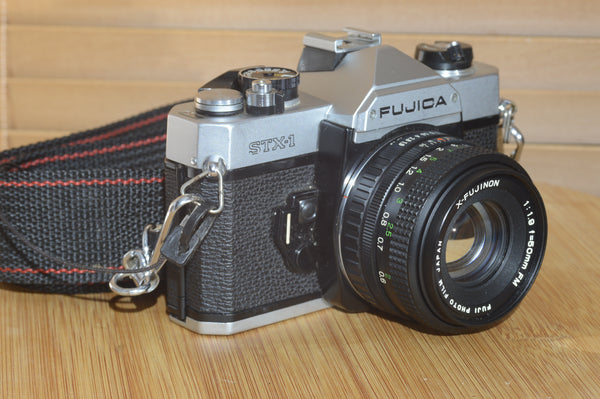 Fujica STX-1 SLR with 50mm f1.9 Lens. These are very solid and striking vintage cameras.