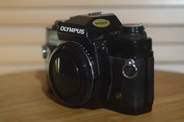 Black Olympus OM40 programme 35mm SLR (body only). Great condition. - Rewind Cameras 