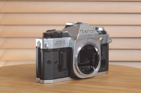 Canon AE-1 P 35mm SLR camera body by Rewind Cameras, shown with its classic design and control dials on the body alone.