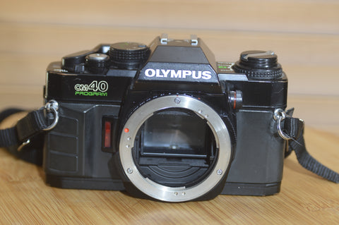 Black Olympus OM40 programme 35mm SLR (body only).  Good condition.