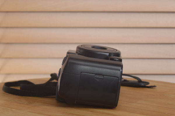Pentax AZ200 35mm film camera in boxed condition, by Rewind Cameras, showing the front view with lens and controls.
