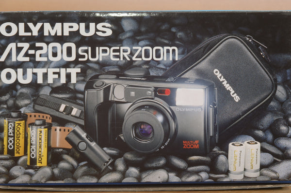 Pentax AZ200 35mm film camera in box by Rewind Cameras, showing the camera with lens and packaging in excellent condition.