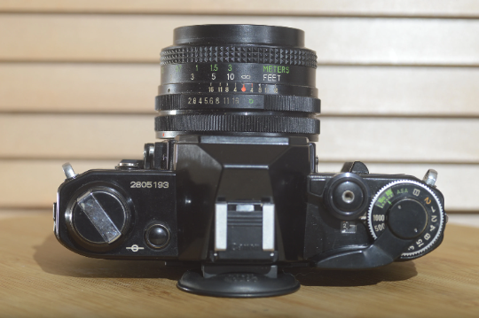 Black Canon AE1 with Vivitar 28mm f2.8 lens. Fantastic set up and beautiful condition - Rewind Cameras 