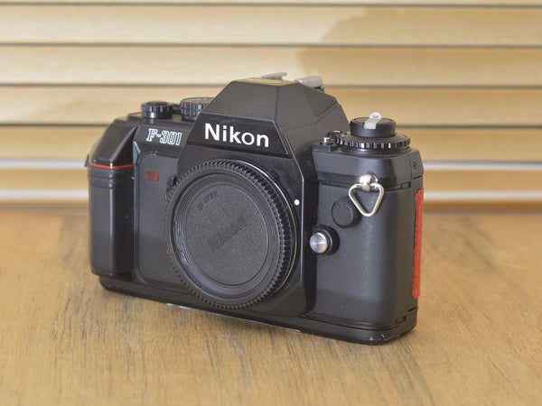 Nikon F-301 - custom red back. In lovely condition and looks striking with the red back custom wrap. This is a fantastic Nikon camera - Rewind Cameras 