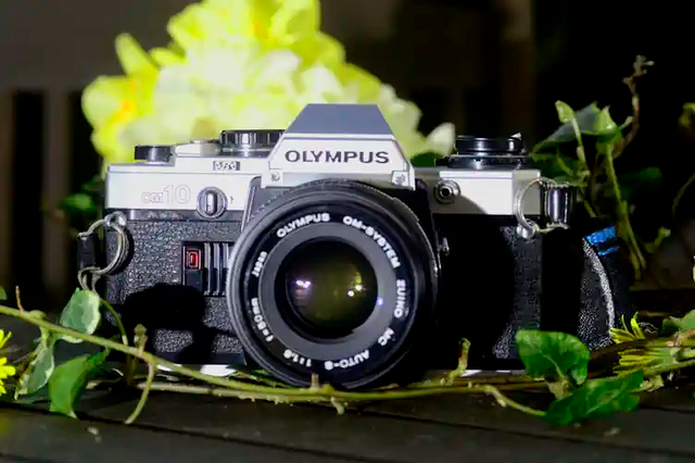 Mint condition Olympus  OM10 Vintage camera with standard lens at rewindcameras.co.uk