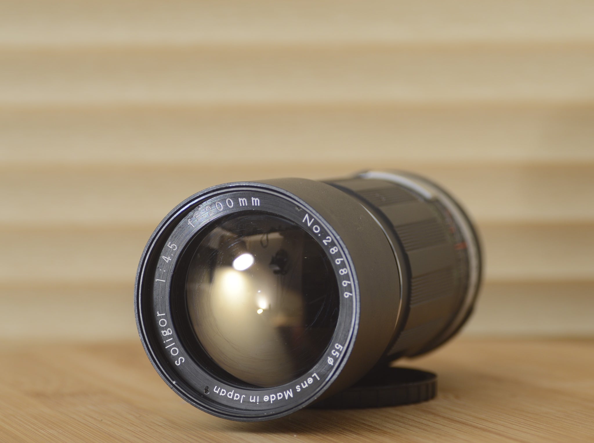 Gorgeous 200mm f4.5 M42 fit lens by Soligor with hard case.  This is a magnificent lens for your existing M42 lens fit Camera - RewindCameras quality vintage cameras, fully tested and service