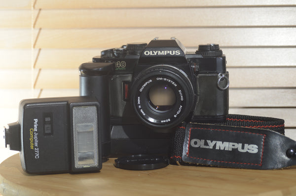 Olympus OM40 Program Starter pack. Comes with 35mm film camera, lens and more - RewindCameras quality vintage cameras, fully tested and serviced
