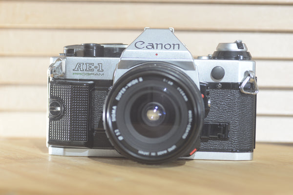 Canon AE1 P with Sigma Super wide 2 24mm f2.8 FD lens! Beautiful example of a well looked after vintage camera. - RewindCameras quality vintage cameras, fully tested and serviced