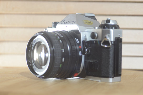 Canon AE1 P with Sigma Super wide 2 24mm f2.8 FD lens! Beautiful example of a well looked after vintage camera. - RewindCameras quality vintage cameras, fully tested and serviced