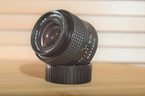 Stunning Pentacon Prakticar 28mm f2.8 MC PB lens. Perfect addition to your Praktica set up. - RewindCameras quality vintage cameras, fully tested and serviced
