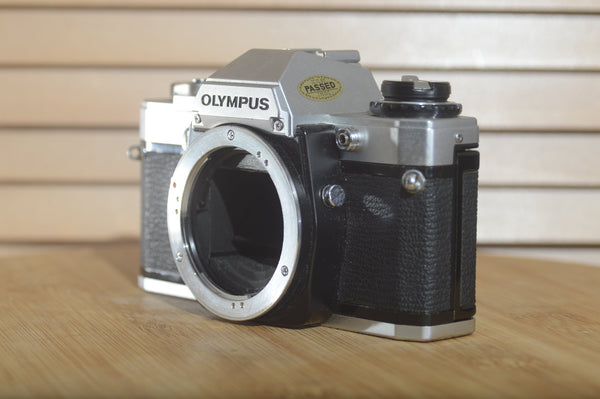 Olympus OM10 35mm Film Camera. Fantastic condition. Brilliant beginner camera. Easy to operate - RewindCameras quality vintage cameras, fully tested and serviced