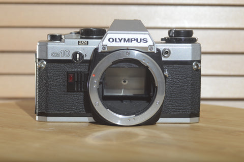 Olympus OM10 35mm Film Camera. Fantastic condition. Brilliant beginner camera. Easy to operate - RewindCameras quality vintage cameras, fully tested and serviced