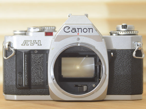 Canon AV1 (body only). Good working condition. These are perfect for beginners or those who want to explore vintage photography. - RewindCameras quality vintage cameras, fully tested and serv