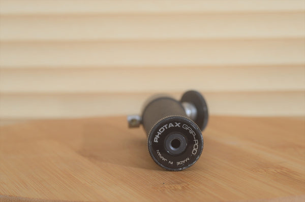 Adorable Pocket Size Photax Grip-Pod. A Perfect addition to any level of photographers kit. Great for flash or slow long exposure photography - RewindCameras quality vintage cameras, fully te
