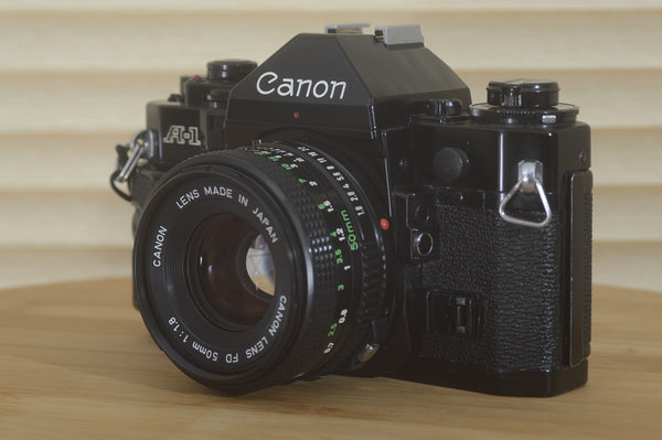 Canon A1 35mm SLR Camera in Near Mint Condition With 50mm 1.8 Lens. The Ultimate 35mm camera - RewindCameras quality vintage cameras, fully tested and serviced