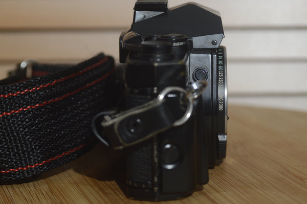 Black Olympus OM4 SLR Camera Body With Olympus Strap. In Fantastic condition. - RewindCameras quality vintage cameras, fully tested and serviced