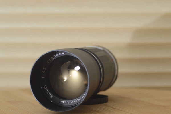Gorgeous 200mm f4.5 M42 fit lens by Soligor with hard case.  This is a magnificent lens for your existing M42 lens fit Camera - RewindCameras quality vintage cameras, fully tested and service