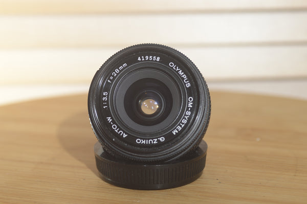 Gorgeous Olympus 28mm f3.5 Zuiko Lens. A perfect addition to your vintage Olympus set up. - RewindCameras quality vintage cameras, fully tested and serviced