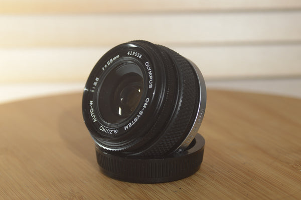 Gorgeous Olympus 28mm f3.5 Zuiko Lens. A perfect addition to your vintage Olympus set up. - RewindCameras quality vintage cameras, fully tested and serviced