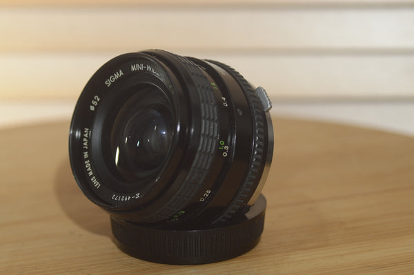 Sigma OM 28mm f2.8 Mini Wide lens. This is a lovely wide angle lens in superb condition! - RewindCameras quality vintage cameras, fully tested and serviced
