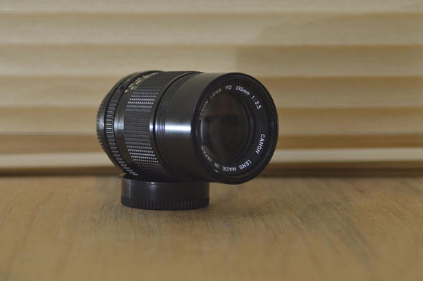 Canon FD 135mm 3.5 lens with built in lens hood in box. Beautiful lens especially for portraiture work. Stunning optics with Fab results! - RewindCameras quality vintage cameras, fully tested