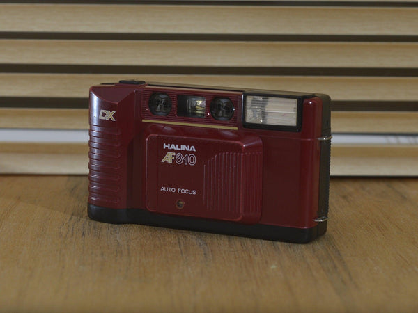Steam Engine Red Halina AF 810 DX 35mm point and shoot compact camera. This is great for getting into vintage photography. It’s pocket sized - RewindCameras quality vintage cameras, fully t