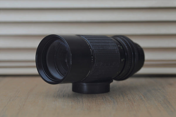 Sigma M42 100-200mm f4.5 Zoom lens with built in lens hood and dedicated case. - RewindCameras quality vintage cameras, fully tested and serviced