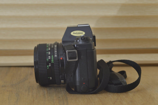 Beautiful Canon T50 camera with 28mm 2.8 FD lens. In lovely condition, feels just like a digital It couldn't be easier to get into 35mm film - RewindCameras quality vintage cameras, fully tes