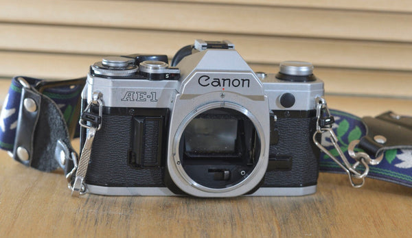 Beautiful Canon AE1 Body only with quirky flower strap the true design classic form Canon, now very collectable and you can see why ! - RewindCameras quality vintage cameras, fully tested and