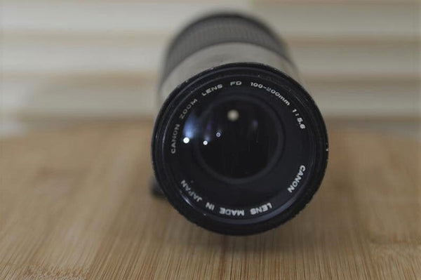 Lovely Canon FD 100-200mm f5.6 Zoom lens with case - RewindCameras quality vintage cameras, fully tested and serviced